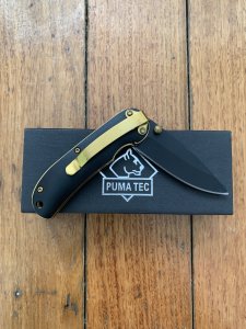Puma Knife: Puma Tec Black & Gold Framed Laser Cut Folding Liner Lock Knife