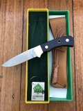 Puma Knife: Puma Original 1986 4 Star Fixed Blade Knife with Black Buffalo Handle in Original Green and Yellow Box