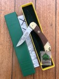 Puma Knife: Puma 1989 model 765 Setter Folding Knife with Jacaranda Handle Original Box and matching Warranty