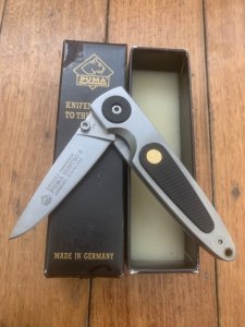Puma Knife: Puma HUNTEC II Plain Edge Black Handled Linerlock Folding Knife in Puma Box