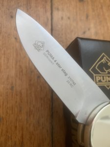 Puma Knife: Puma 2025  Date Stamp 4 Star Full Sized Folding Lock Knife with Stag Antler Handle