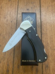 Puma Knife: Puma 2025 Date Stamp 4 Star Folding Lock Blade Knife with Black Buffalo Handle