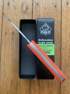 Puma Knife: Puma IP Pathfinder with gut hook, Orange Micarta Handle
