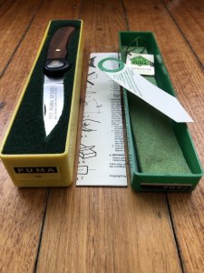 Puma Knife: Puma 1988 model 777 Sport Folding Knife with Walnut Handle Original Box and matching Warranty