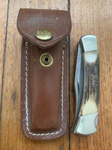 Buck Knife: 1989 Model Buck 110 Classic with Aged Stag Handle and Damascus Blade and Leather Pouch