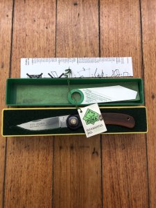 Puma Knife: Puma 1988 model 777 Sport Folding Knife with Walnut Handle Original Box and matching Warranty