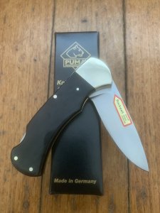 Puma Knife: Puma 2025 Date Stamp 4 Star Folding Lock Blade Knife with Black Buffalo Handle