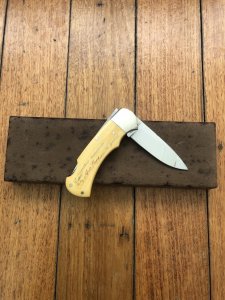 Puma Knife: Puma 1987 Original Scrimshawed 4 Star Folding Lock Blade Knife with Cape buffalo in Presentation Box