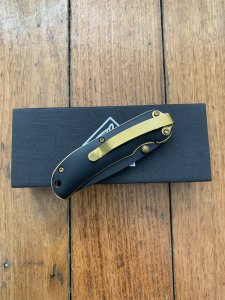 Puma Knife: Puma Tec Black & Gold Framed Laser Cut Folding Liner Lock Knife