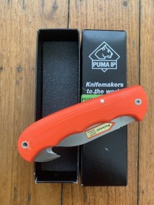 Puma Knife: Puma IP Pathfinder with gut hook, Orange Micarta Handle