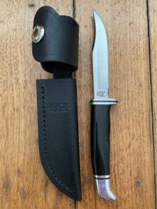 Buck Knife: Buck 2005 Woodsman 102 with Black Phenolic Handle & Leather Sheath