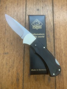 Puma Knife: Puma 2025 Date Stamp 4 Star Folding Lock Blade Knife with Black Buffalo Handle