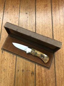 Puma Knife: Puma 1987 Original Scrimshawed 4 Star Folding Lock Blade Knife with Cape buffalo in Presentation Box