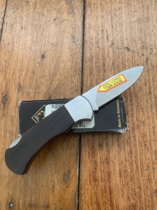 Puma Knife: 2004 Puma 4 Star Mini Folding Lock Knife with Black Buffalo Horn Handle