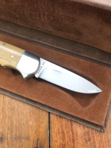 Puma Knife: Puma 1987 Original Scrimshawed 4 Star Folding Lock Blade Knife with Cape buffalo in Presentation Box