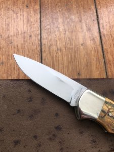 Puma Knife: Puma 1987 Original Scrimshawed 4 Star Folding Lock Blade Knife with Cape buffalo in Presentation Box