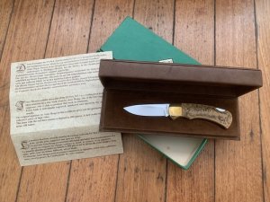 Puma Knife: Puma 1983 Original 4 Star Folding Lock Blade Scrimshawed Roaring Red Stag Knife with in Presentation Box #71/300