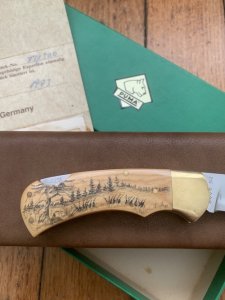 Puma Knife: Puma 1983 Original 4 Star Folding Lock Blade Scrimshawed Roaring Red Stag Knife with in Presentation Box #71/300