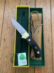 Puma Knife: Puma Original 1992 4 Star Fixed Blade Knife with Black Ebony Handle in Original Green and Yellow Box #26291