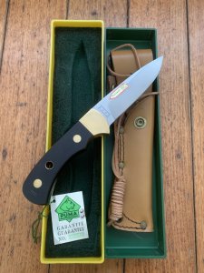 Puma Knife: Puma Original 1992 4 Star Fixed Blade Knife with Black Ebony Handle in Original Green and Yellow Box #26291