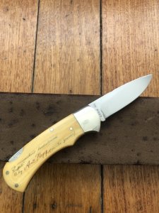 Puma Knife: Puma 1987 Original Scrimshawed 4 Star Folding Lock Blade Knife with Cape buffalo in Presentation Box