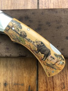 Puma Knife: Puma 1987 Original Scrimshawed 4 Star Folding Lock Blade Knife with Cape buffalo in Presentation Box