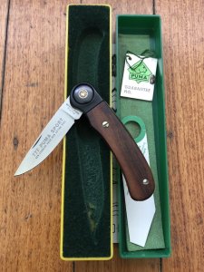 Puma Knife: Puma 1988 model 777 Sport Folding Knife with Walnut Handle Original Box and matching Warranty