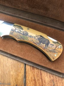 Puma Knife: Puma 1987 Original Scrimshawed 4 Star Folding Lock Blade Knife with Cape buffalo in Presentation Box