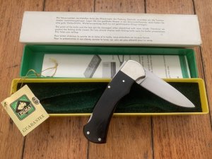 Puma Knife: Puma Original 1977 Full Size 4 Star 725 Folding Lock Blade Knife with Ebony Micarta Handle in Original Box #29771