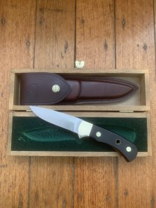 Puma Knife: Puma Original 1979 4 Star Fixed Blade Knife with Black Ebony Layered Handle in Original Wooden Box #13971