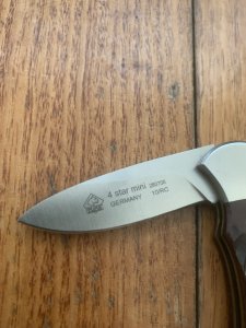 Puma Knife: 2010 Puma 4 Star Mini Folding Lock Knife with Red Jigged Bone Handle
