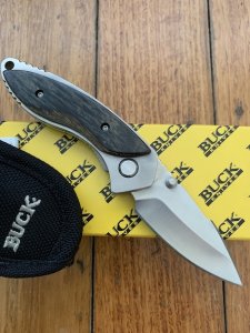 Buck Knife: 2005 Buck B270 Dorado Folding Liner Lock Knife with Charcoal Birchwood Laminated Handle, Pouch and Original Box