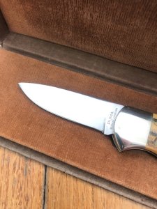 Puma Knife: Puma 1987 Original Scrimshawed 4 Star Folding Lock Blade Knife with Cape buffalo in Presentation Box