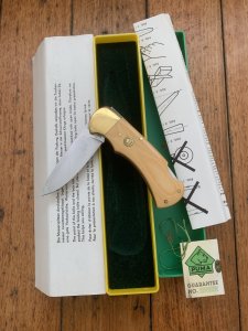 Puma Knife: Puma Original 1982 4 Star Folding Lock Blade Knife with Ivory Micarta Handle in Original Box #16281