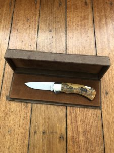 Puma Knife: Puma 1987 Original Scrimshawed 4 Star Folding Lock Blade Knife with Cape buffalo in Presentation Box