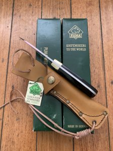 Puma Knife: Puma Original 1994 4 Star Fixed Blade Knife with Black Micarta Handle in Original Green Box