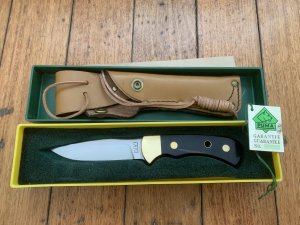 Puma Knife: Puma Original 1992 4 Star Fixed Blade Knife with Black Ebony Handle in Original Green and Yellow Box #26291