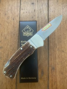 Puma Knife: Puma 2025  Date Stamp 4 Star Full Sized Folding Lock Knife with Stag Antler Handle