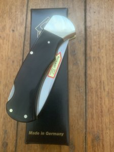 Puma Knife: Puma 2025 Date Stamp 4 Star Folding Lock Blade Knife with Black Buffalo Handle