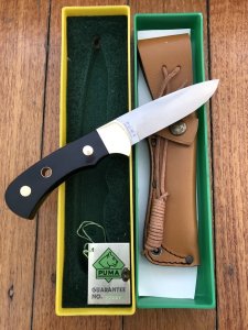 Puma Knife: Puma Original 1986 4 Star Fixed Blade Knife with Black Buffalo Handle in Original Green and Yellow Box