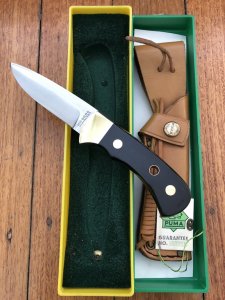 Puma Knife: Puma Original 1984 4 Star Fixed Blade Knife with Black Buffalo Handle in Original Green and Yellow Box