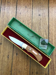 Puma Knife: Puma Original 1980 4 Star Folding Lock Blade Knife with Dark Orange Ivory Micarta Handle in Original Box & Warranty