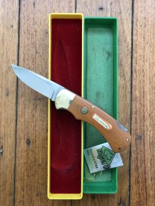 Puma Knife: Puma Original 1980 4 Star Folding Lock Blade Knife with Dark Orange Ivory Micarta Handle in Original Box & Warranty
