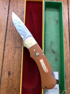 Puma Knife: Puma Original 1980 4 Star Folding Lock Blade Knife with Dark Orange Ivory Micarta Handle in Original Box & Warranty