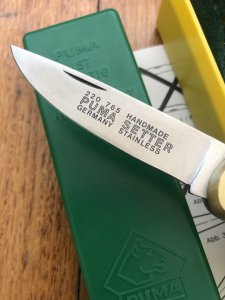 Puma Knife: Puma 1989 model 765 Setter Folding Knife with Jacaranda Handle Original Box and matching Warranty