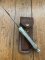 Buck Knife: 1989 Model Buck 110 Classic with Aged Stag Handle and Damascus Blade and Leather Pouch