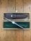 Puma Knife: Puma Original 1979 4 Star Fixed Blade Knife with Black Ebony Layered Handle in Original Wooden Box #13971
