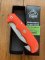 Puma Knife: Puma IP Pathfinder with gut hook, Orange Micarta Handle