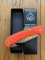Puma Knife: Puma IP Pathfinder with gut hook, Orange Micarta Handle