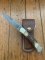 Buck Knife: 1989 Model Buck 110 Classic with Aged Stag Handle and Damascus Blade and Leather Pouch